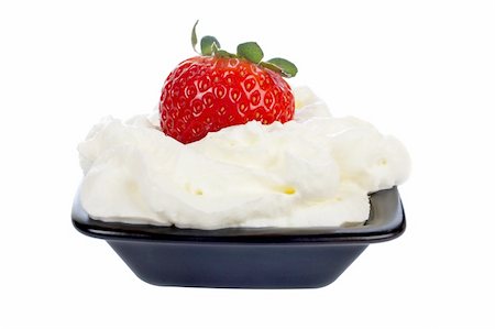simsearch:400-03920561,k - One fresh juicy strawberry over a cream, isolated on white background Photographie de stock - Aubaine LD & Abonnement, Code: 400-03929311
