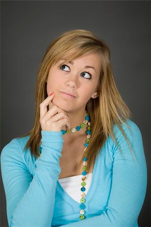simsearch:400-04960190,k - Teenage girl posing on gray background with some attitude Stock Photo - Budget Royalty-Free & Subscription, Code: 400-03929607