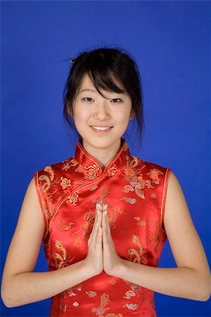 simsearch:862-06676287,k - Beautiful young Asian girl posing for a portrait wearing a China Dress Stock Photo - Budget Royalty-Free & Subscription, Code: 400-03929831