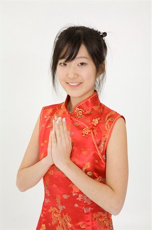 simsearch:862-06676287,k - Beautiful young Asian girl posing for a portrait wearing a China Dress Stock Photo - Budget Royalty-Free & Subscription, Code: 400-03929832