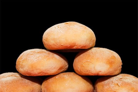 people eating bagels - Home-made pyramid on a black background Photographie de stock - Aubaine LD & Abonnement, Code: 400-03920035