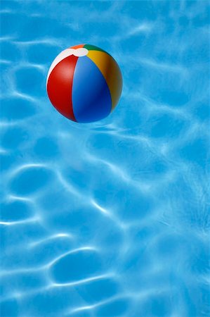 simsearch:640-01349416,k - Colorful beachball floating in bright blue pool Stockbilder - Microstock & Abonnement, Bildnummer: 400-03920038