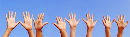 simsearch:400-04448769,k - Row of hands with open palms on blue sky background Stockbilder - Microstock & Abonnement, Bildnummer: 400-03920404