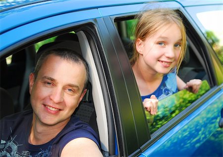 family and luggage summer - Father and daughter sitting inside the car ready to go on family trip Stock Photo - Budget Royalty-Free & Subscription, Code: 400-03920400