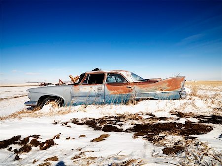 salvage yard classics cars - Classic rusted car in snowy junkyard. Stock Photo - Budget Royalty-Free & Subscription, Code: 400-03920901