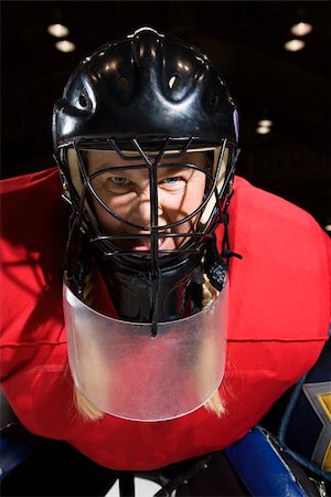 Woman hockey goalie wearing helmet sneering looking intimidating. Stock Photo - Budget Royalty-Free & Subscription, Code: 400-03920929