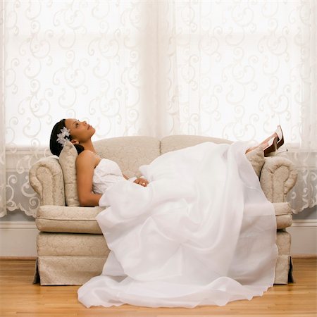 African-American bride lying on love seat. Stock Photo - Budget Royalty-Free & Subscription, Code: 400-03920969