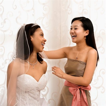 simsearch:400-03925541,k - Asian bridesmaid laughing with African-American bride. Stock Photo - Budget Royalty-Free & Subscription, Code: 400-03920961