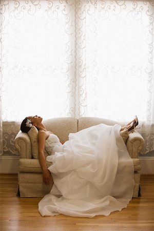 African-American bride lying on love seat. Stock Photo - Budget Royalty-Free & Subscription, Code: 400-03920970