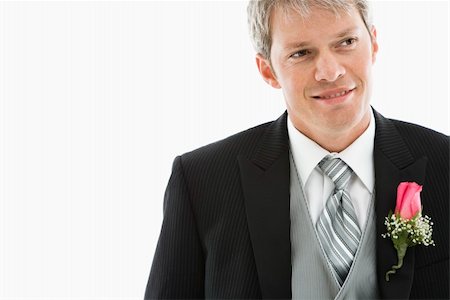 Portrait of Caucasian male in tuxedo with boutonniere. Stock Photo - Budget Royalty-Free & Subscription, Code: 400-03921035