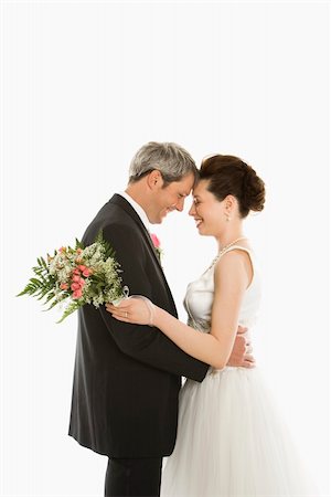 simsearch:400-04950359,k - Portrait of Caucasian groom and Asian bride embracing Stock Photo - Budget Royalty-Free & Subscription, Code: 400-03921046