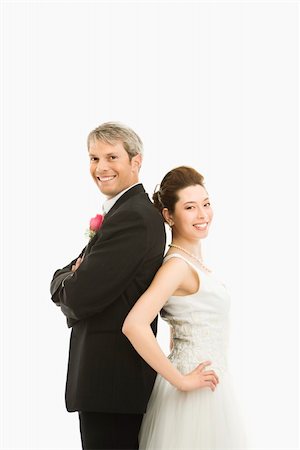 simsearch:400-04950359,k - Portrait of Caucasian groom and Asian bride back to back. Stock Photo - Budget Royalty-Free & Subscription, Code: 400-03921057