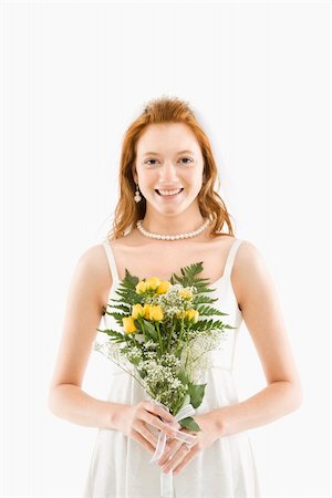 simsearch:400-04950359,k - Portrait of Caucasian bride holding bouquet. Stock Photo - Budget Royalty-Free & Subscription, Code: 400-03921070