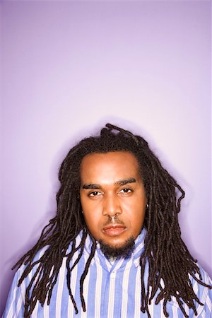 rastafarian - Serious African-American mid-adult man on purple background. Stock Photo - Budget Royalty-Free & Subscription, Code: 400-03921108