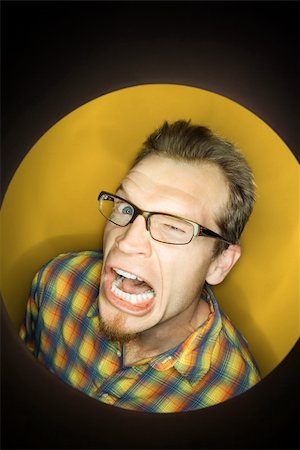simsearch:700-00045320,k - Vignette of adult Caucasian man on yellow background winking and making funny face. Stock Photo - Budget Royalty-Free & Subscription, Code: 400-03921170