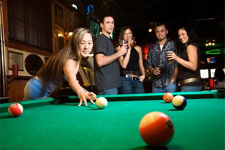 simsearch:400-03921241,k - Young asian woman preparing to hit pool ball while playing billiards. Stock Photo - Budget Royalty-Free & Subscription, Code: 400-03921219