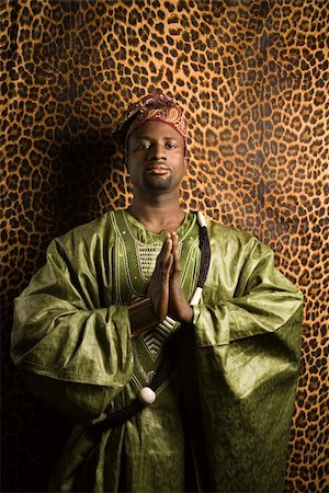 Portrait of African- American mid-adult man in prayer wearing traditional African clothing. Stock Photo - Budget Royalty-Free & Subscription, Code: 400-03921213