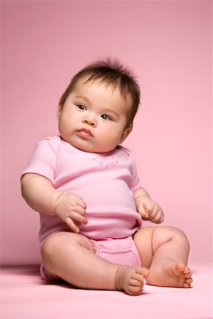 Asian baby sitting up and looking to side. Stock Photo - Budget Royalty-Free & Subscription, Code: 400-03921507
