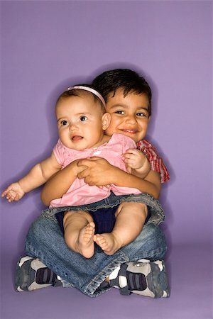 sister hugs baby - Hispanic female baby and male child portrait. Stock Photo - Budget Royalty-Free & Subscription, Code: 400-03921570