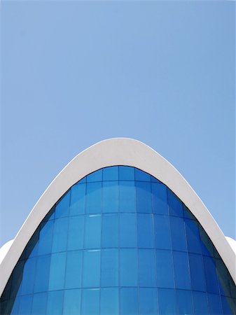 Public Building under a blue sky with beautiful lines and curves. Stockbilder - Microstock & Abonnement, Bildnummer: 400-03921698