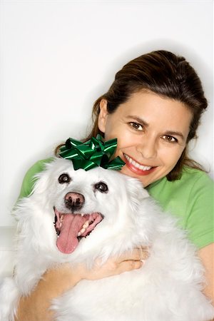 simsearch:400-04446187,k - Caucasian prime adult female holding fluffy white dog. Photographie de stock - Aubaine LD & Abonnement, Code: 400-03921783