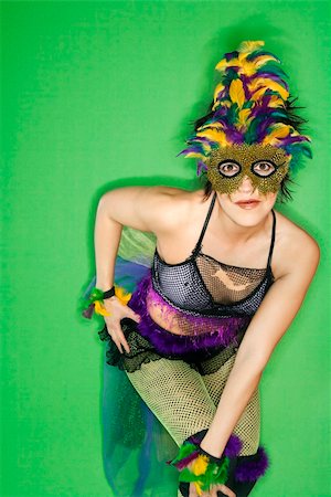 rio carnival - Portrait of Hispanic woman in Mardi Gras type costume and mask standing against green background. Stock Photo - Budget Royalty-Free & Subscription, Code: 400-03921899