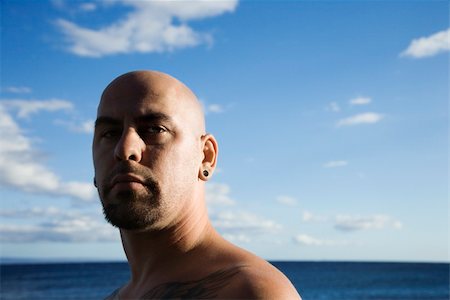 Caucasian prime adult bald male portrait on beach. Photographie de stock - Aubaine LD & Abonnement, Code: 400-03921928