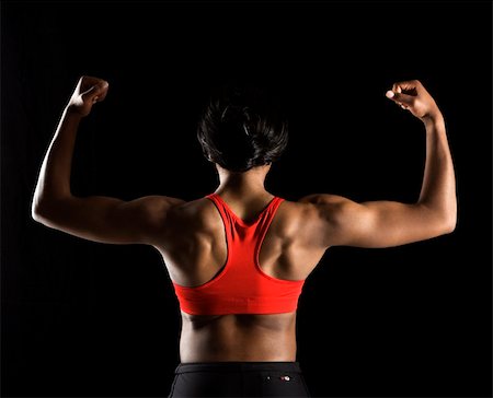 pictures of strong women flexing their biceps - Back of muscular African American woman with biceps flexed. Stock Photo - Budget Royalty-Free & Subscription, Code: 400-03921992