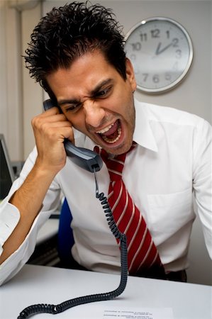 angry businessman screaming on the phone Stock Photo - Budget Royalty-Free & Subscription, Code: 400-03922107