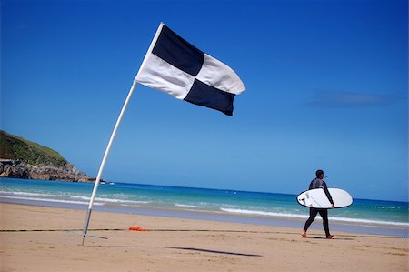 simsearch:400-03916559,k - A surfer and surf area flag. Photographie de stock - Aubaine LD & Abonnement, Code: 400-03922453