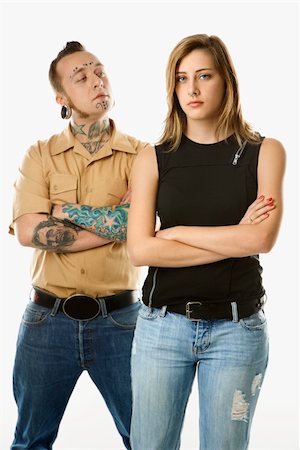 Caucasian mid-adult man looking at teen female who is looking away. Stock Photo - Budget Royalty-Free & Subscription, Code: 400-03923069
