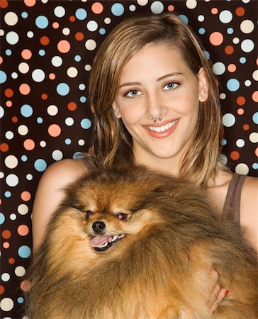 simsearch:400-04951103,k - Caucasian teen female holding Pomeranian dog. Stock Photo - Budget Royalty-Free & Subscription, Code: 400-03923074