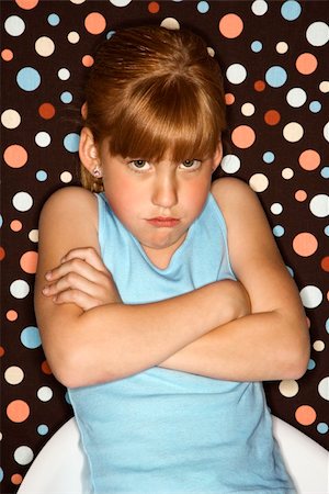 simsearch:614-08270203,k - Caucasian female child pouting with arms crossed. Fotografie stock - Microstock e Abbonamento, Codice: 400-03923101