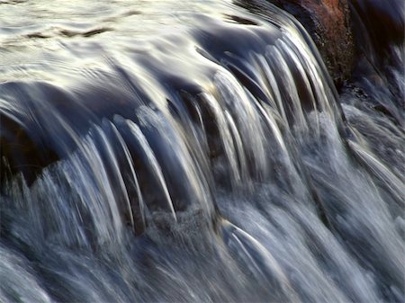 simsearch:400-03909565,k - Flowing water taken with a slow shutter speed in a river stream Stockbilder - Microstock & Abonnement, Bildnummer: 400-03934176