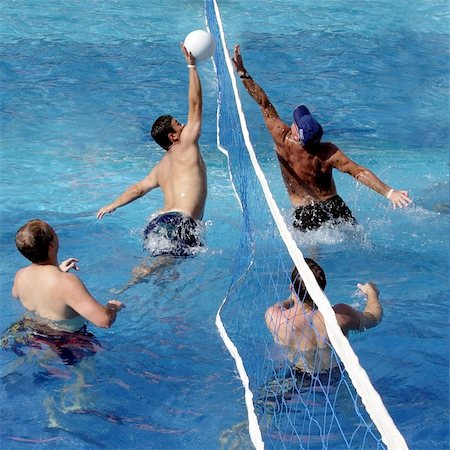 4 men playing water polo in a swimming pool Stock Photo - Budget Royalty-Free & Subscription, Code: 400-03934416
