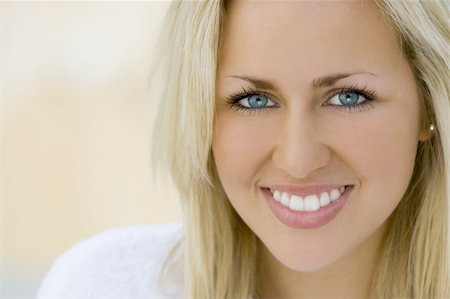 simsearch:400-03920671,k - Close portrait of a beautiful young blue eyed blond woman wearing a bathrobe and bathed in soft natural light Stock Photo - Budget Royalty-Free & Subscription, Code: 400-03934411