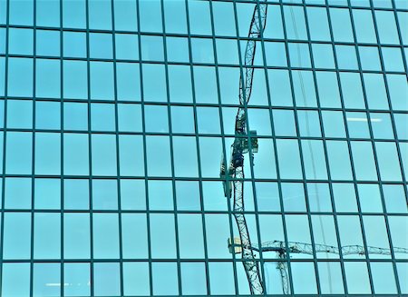 simsearch:400-04458373,k - Cranes reflection on glass building in Poland Stock Photo - Budget Royalty-Free & Subscription, Code: 400-03935109