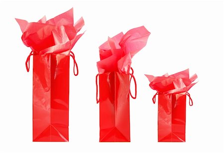 Three red shopping bags isolated on white background Stock Photo - Budget Royalty-Free & Subscription, Code: 400-03935572