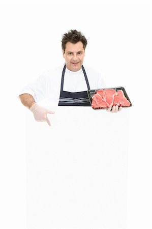 foodservice industries - Butcher pointing to a blank sign Photographie de stock - Aubaine LD & Abonnement, Code: 400-03935634