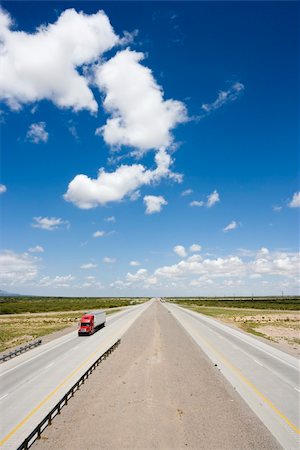 simsearch:400-03948660,k - High angle view of highway with tractor trailer truck and blue cloudy sky. Stock Photo - Budget Royalty-Free & Subscription, Code: 400-03935721