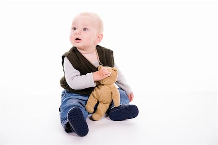 simsearch:632-06779167,k - curious little boy over white background Foto de stock - Royalty-Free Super Valor e Assinatura, Número: 400-03936226