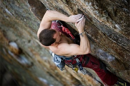 simsearch:400-03936239,k - A male climber, viewed from above, climbs a very high and steep crag. Stockbilder - Microstock & Abonnement, Bildnummer: 400-03936239