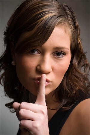 shushing girl - Woman with finger on lips Stock Photo - Budget Royalty-Free & Subscription, Code: 400-03936301