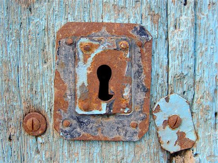 simsearch:845-04826944,k - Blue door with rusty keyhole Photographie de stock - Aubaine LD & Abonnement, Code: 400-03936562