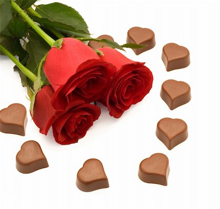 simsearch:400-03967470,k - Red roses and heart shaped chocolate Fotografie stock - Microstock e Abbonamento, Codice: 400-03937199