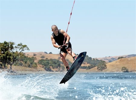 Boy Wakeboarding on the lake Stock Photo - Budget Royalty-Free & Subscription, Code: 400-03937432