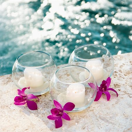 simsearch:400-03925518,k - Three candles and three purple orchids by pool. Stockbilder - Microstock & Abonnement, Bildnummer: 400-03937633