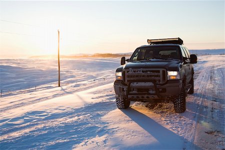 simsearch:400-03944669,k - Truck on ice covered road and snowy rural landscape. Photographie de stock - Aubaine LD & Abonnement, Code: 400-03937732