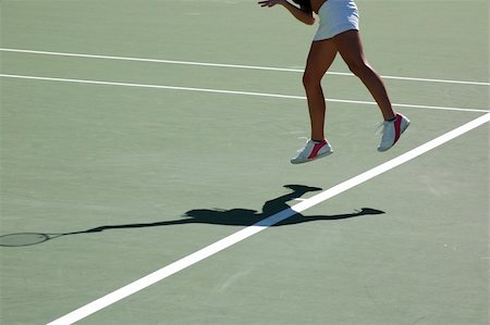 simsearch:400-08755898,k - A female tennis player and her shadow during a competition Stock Photo - Budget Royalty-Free & Subscription, Code: 400-03938006