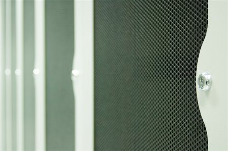 Close up of the door locks on server racks in a data centre Stock Photo - Budget Royalty-Free & Subscription, Code: 400-03938001